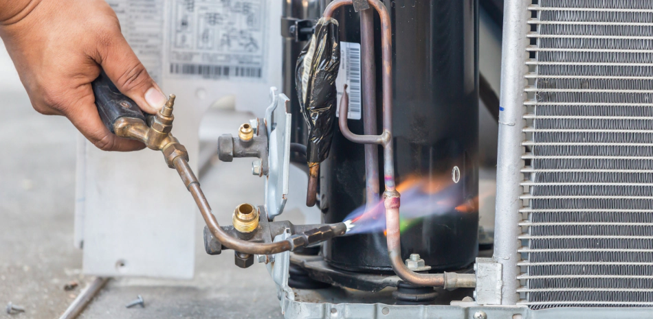 worker checking a commercial hvac