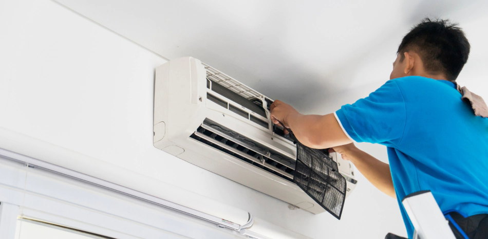 worker installing a new white ac